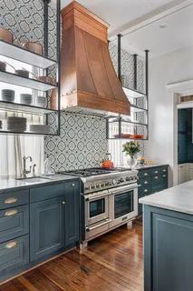 a large kitchen with a table and chairs