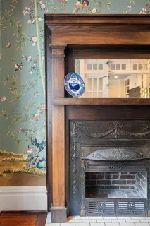 a view of a dining room with furniture wooden floor and chandelier