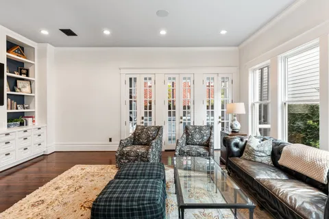 a stove top oven sitting inside of a kitchen