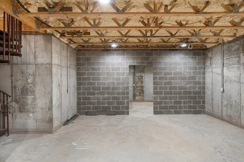 a view of empty room with a wooden door