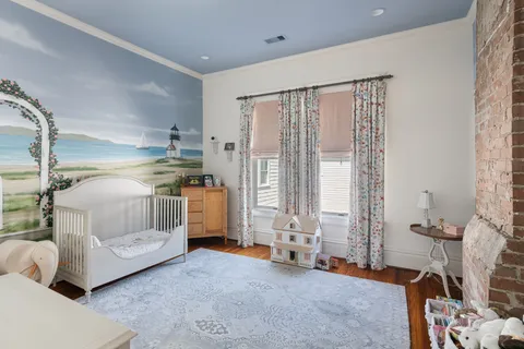 a bedroom with furniture and a window