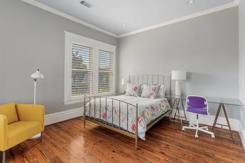 a spacious bathroom with a granite countertop sink a toilet and a shower