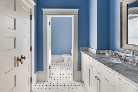 a view of a hall with wooden floor