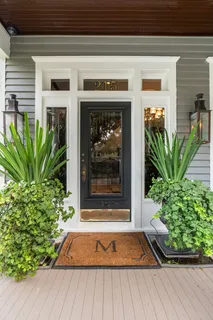 a front view of a house with a yard table and chairs