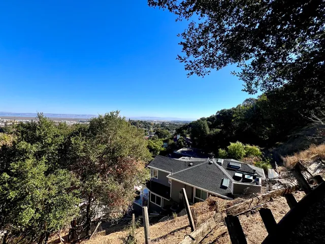 a view of a terrace with a table and chairs