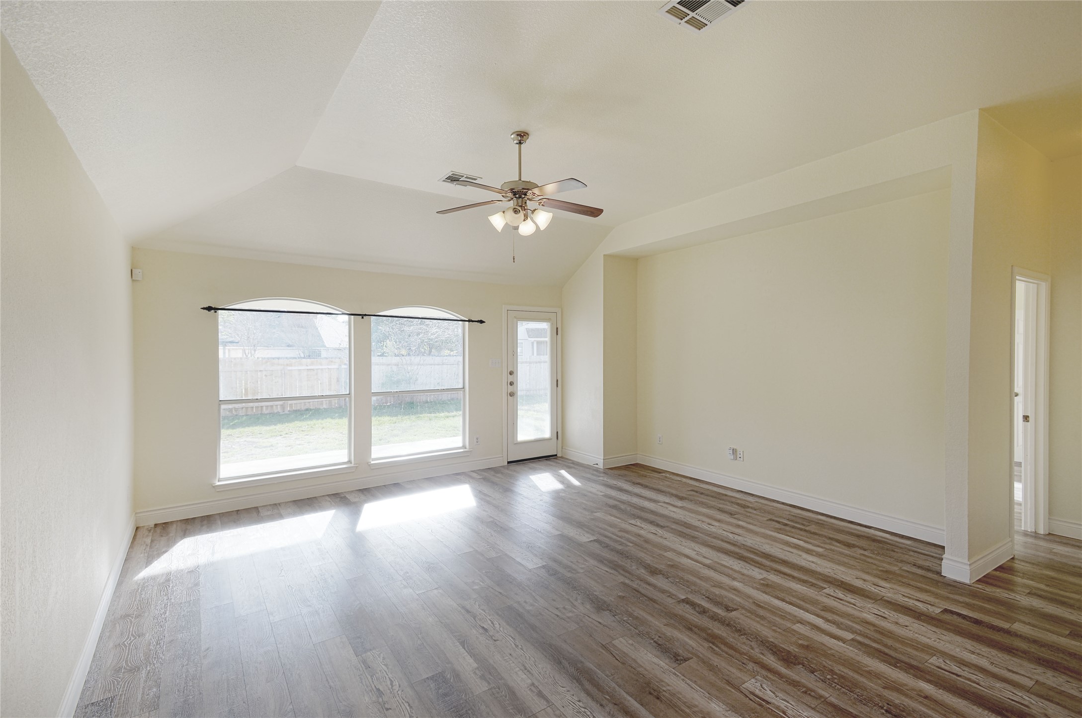 2129 Dry Tortugas Trail Austin, TX 78747 - Photo 12 of 38 an empty room with wooden floor and windows