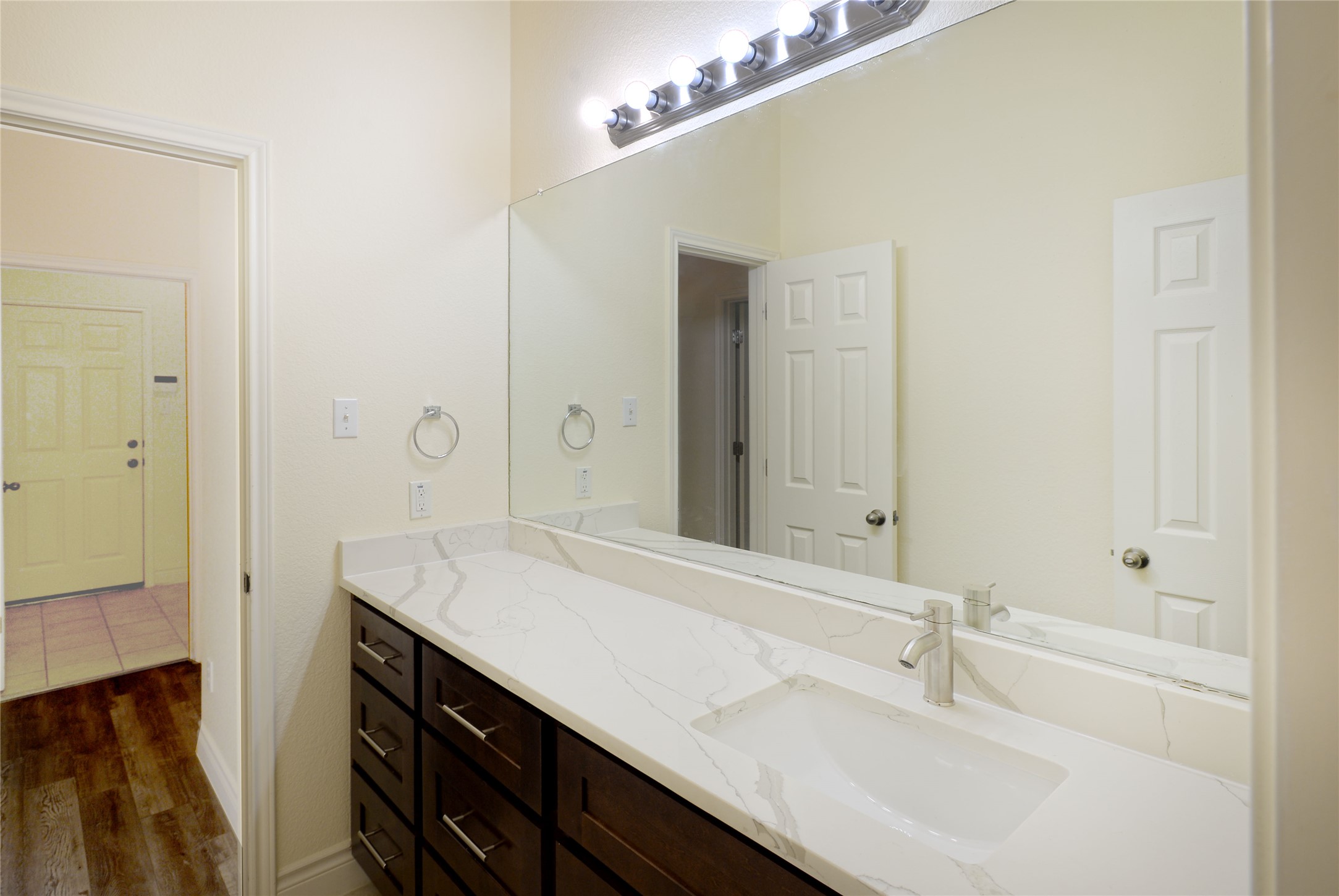 2129 Dry Tortugas Trail Austin, TX 78747 - Photo 20 of 38 a bathroom with a sink double vanity and a mirror