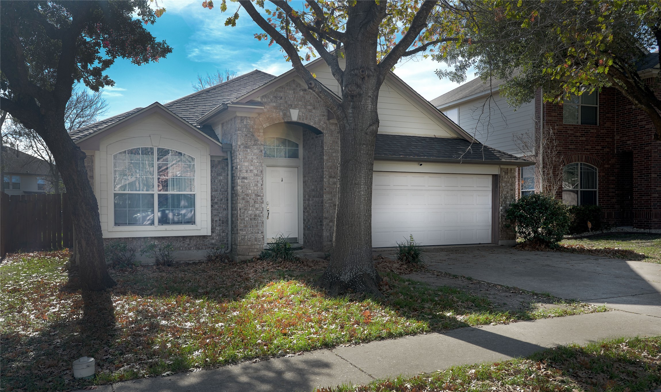 2129 Dry Tortugas Trail Austin, TX 78747 - Photo 2 of 38 a front view of a house with a yard