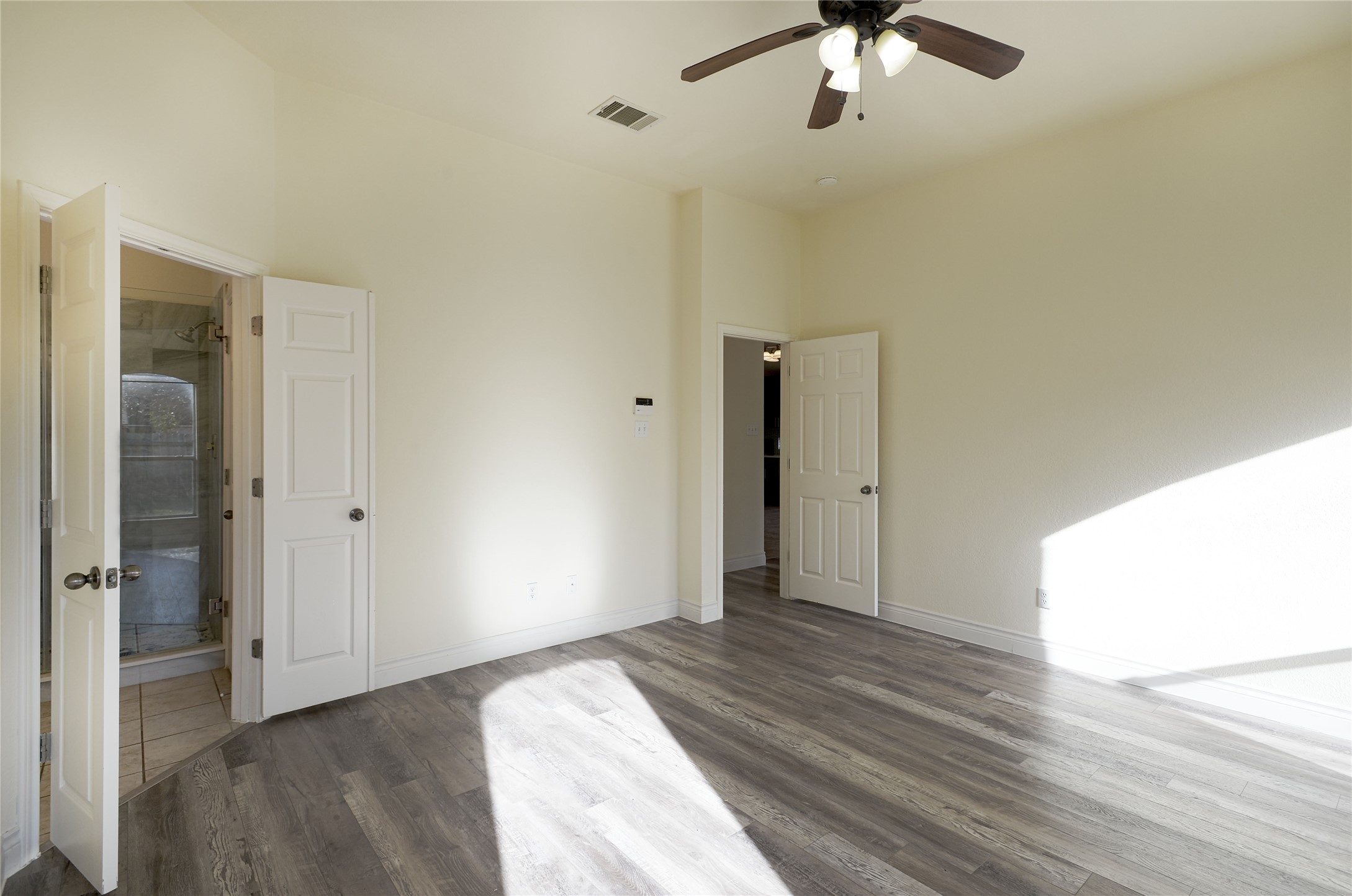 2129 Dry Tortugas Trail Austin, TX 78747 - Photo 25 of 38 a view of empty room with wooden floor