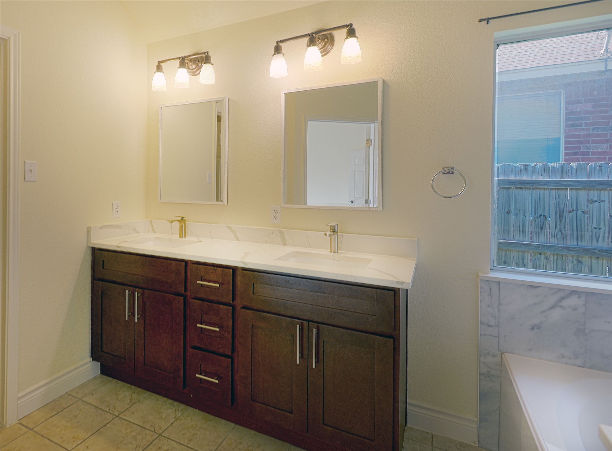 2129 Dry Tortugas Trail Austin, TX 78747 - Photo 30 of 38 a bathroom with a double vanity sink and a mirror