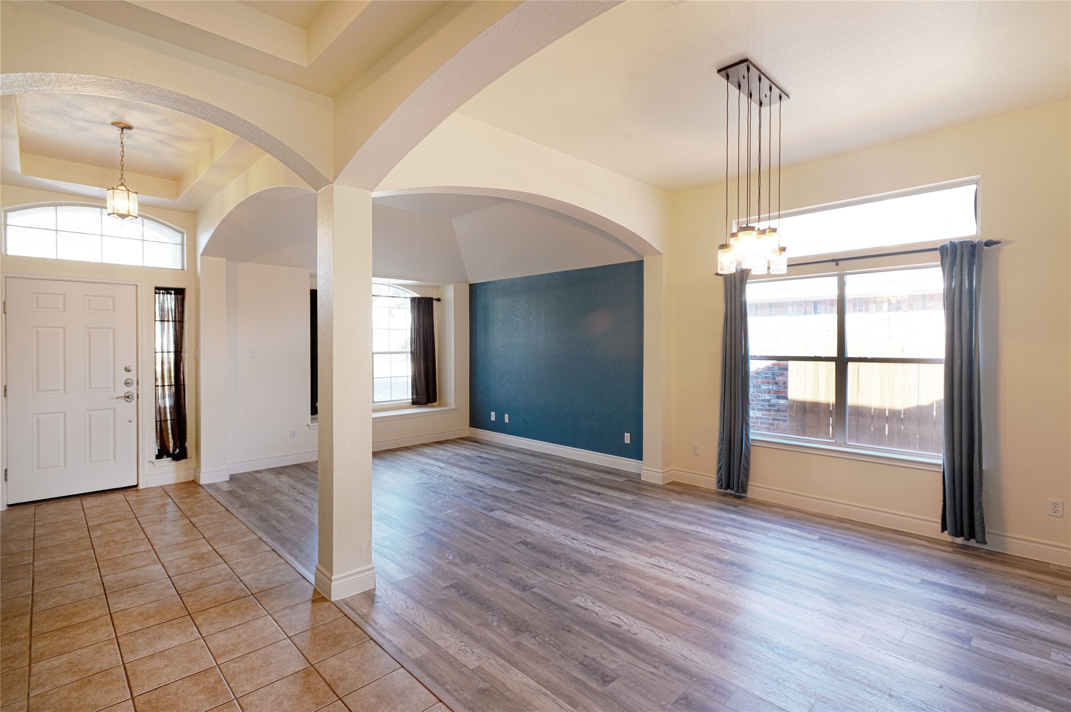 2129 Dry Tortugas Trail Austin, TX 78747 - Photo 3 of 38 an empty room with wooden floor and windows