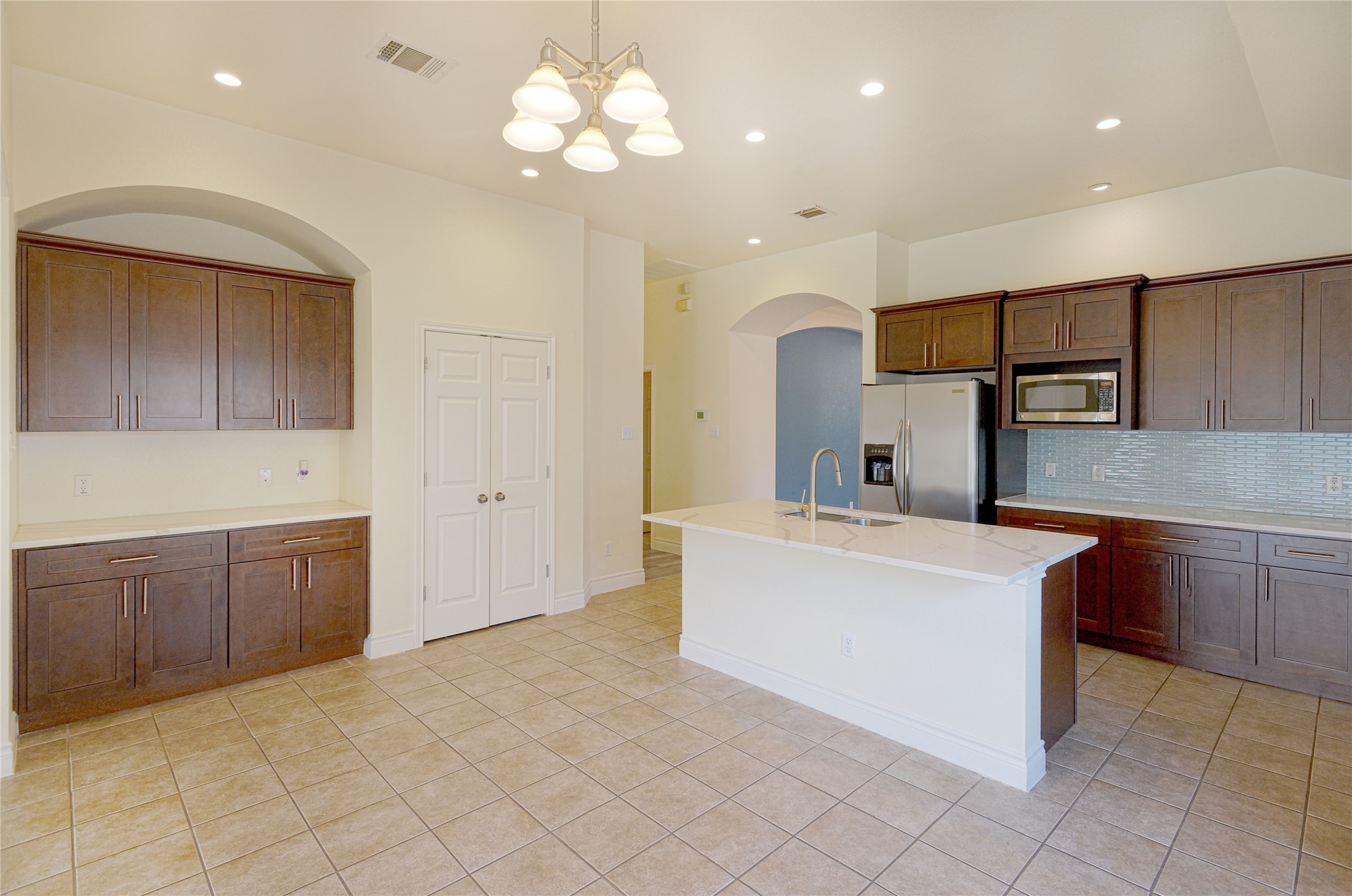 2129 Dry Tortugas Trail Austin, TX 78747 - Photo 6 of 38 a large kitchen with cabinets