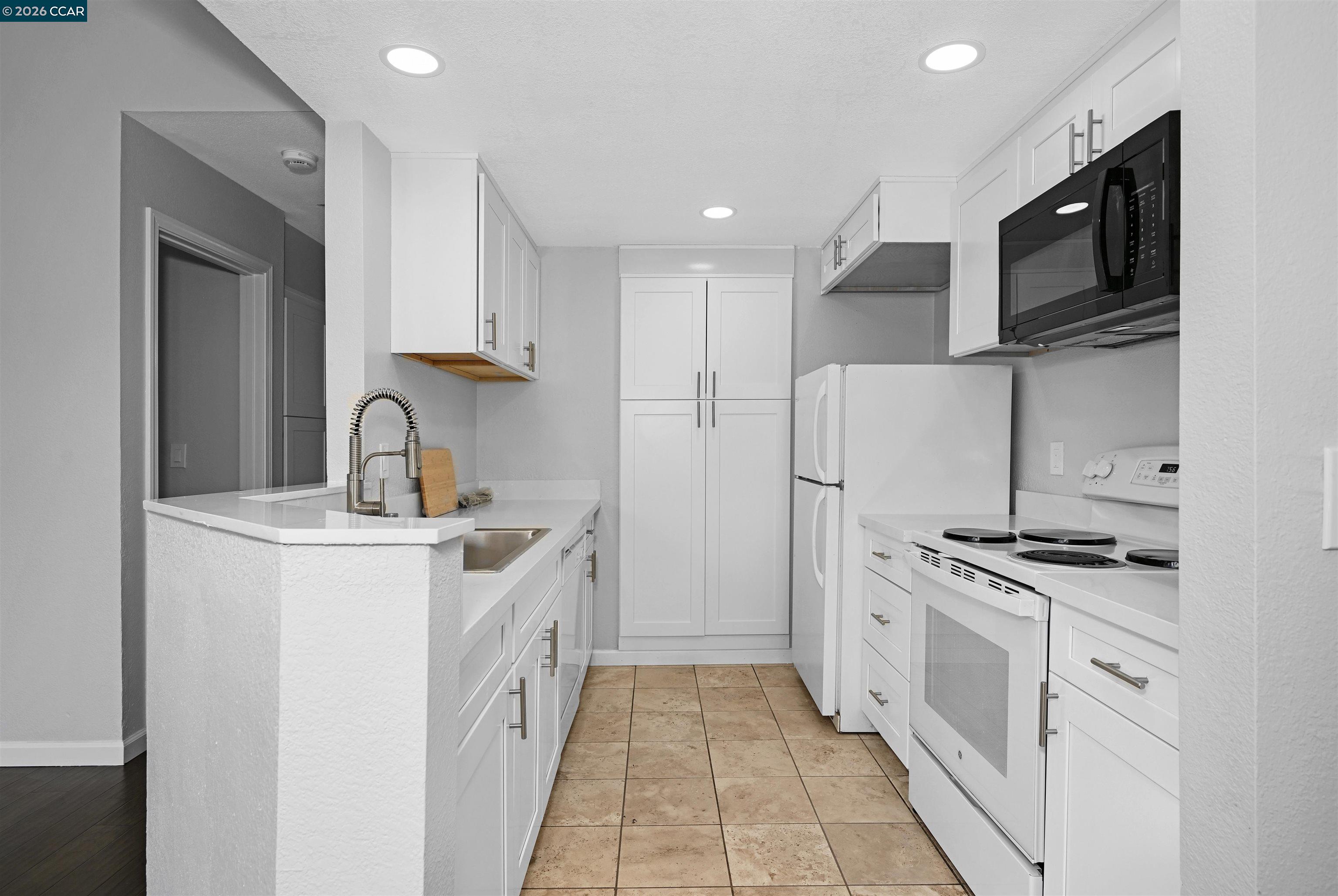 3659 Crow Canyon Road San Ramon, CA 94582 - Photo 13 of 26 a kitchen with stainless steel appliances granite countertop a stove a sink and a refrigerator