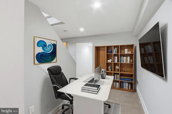 a view of a workspace with furniture