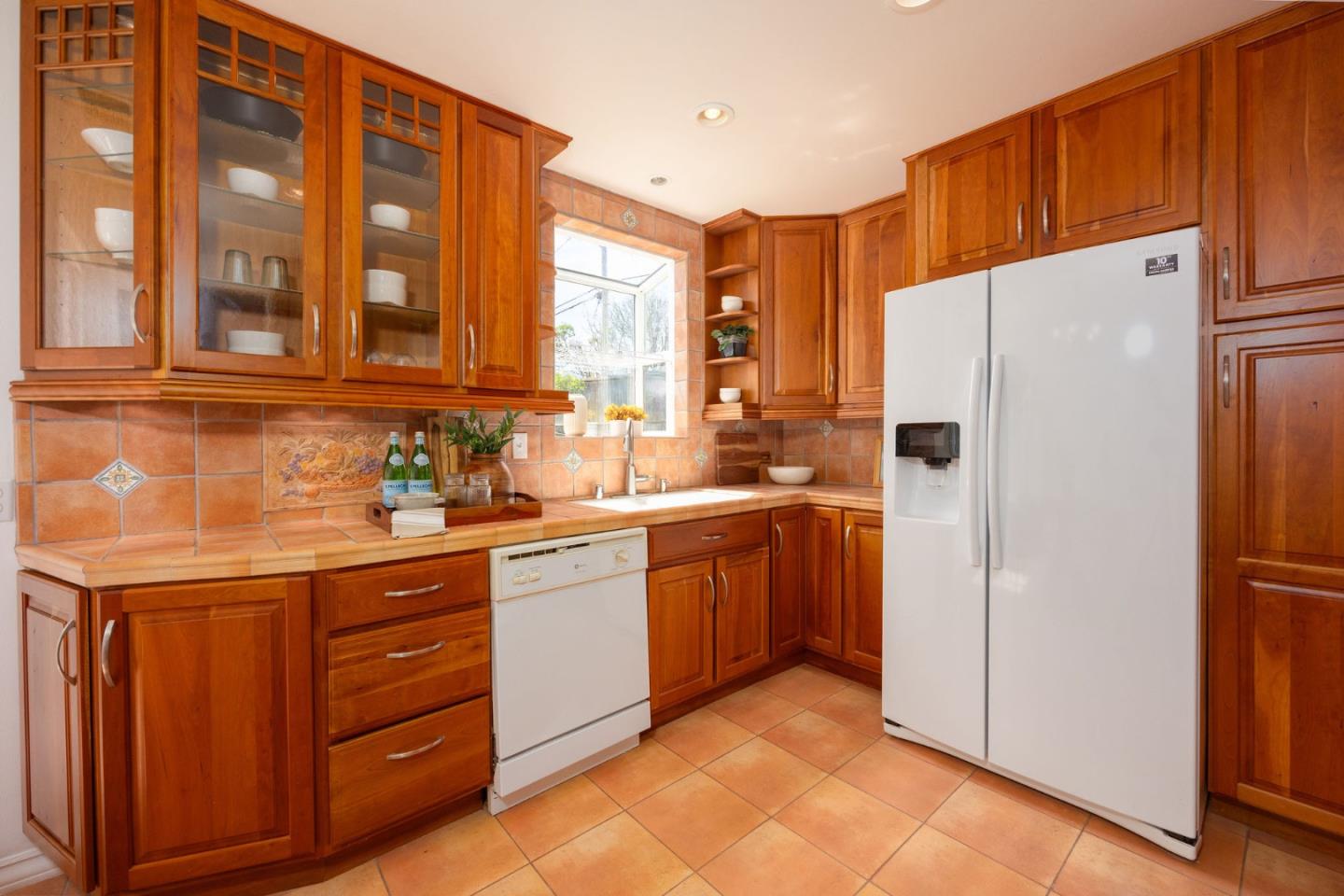 304 Nelson Avenue Pacifica, CA 94044 - Photo 15 of 39 a kitchen with stainless steel appliances granite countertop a refrigerator and a sink