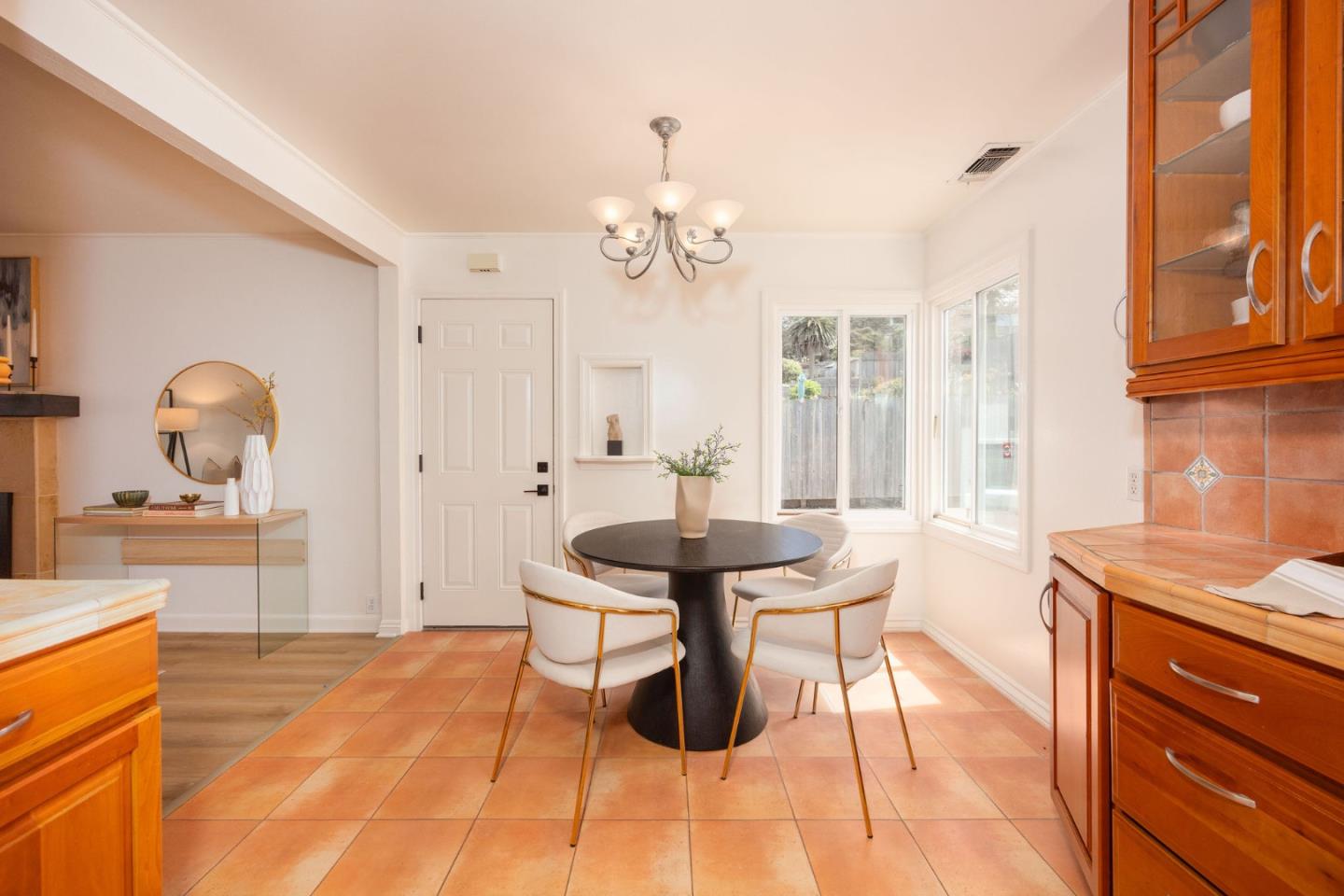 304 Nelson Avenue Pacifica, CA 94044 - Photo 17 of 39 a view of a dining room with furniture a chandelier and wooden floor