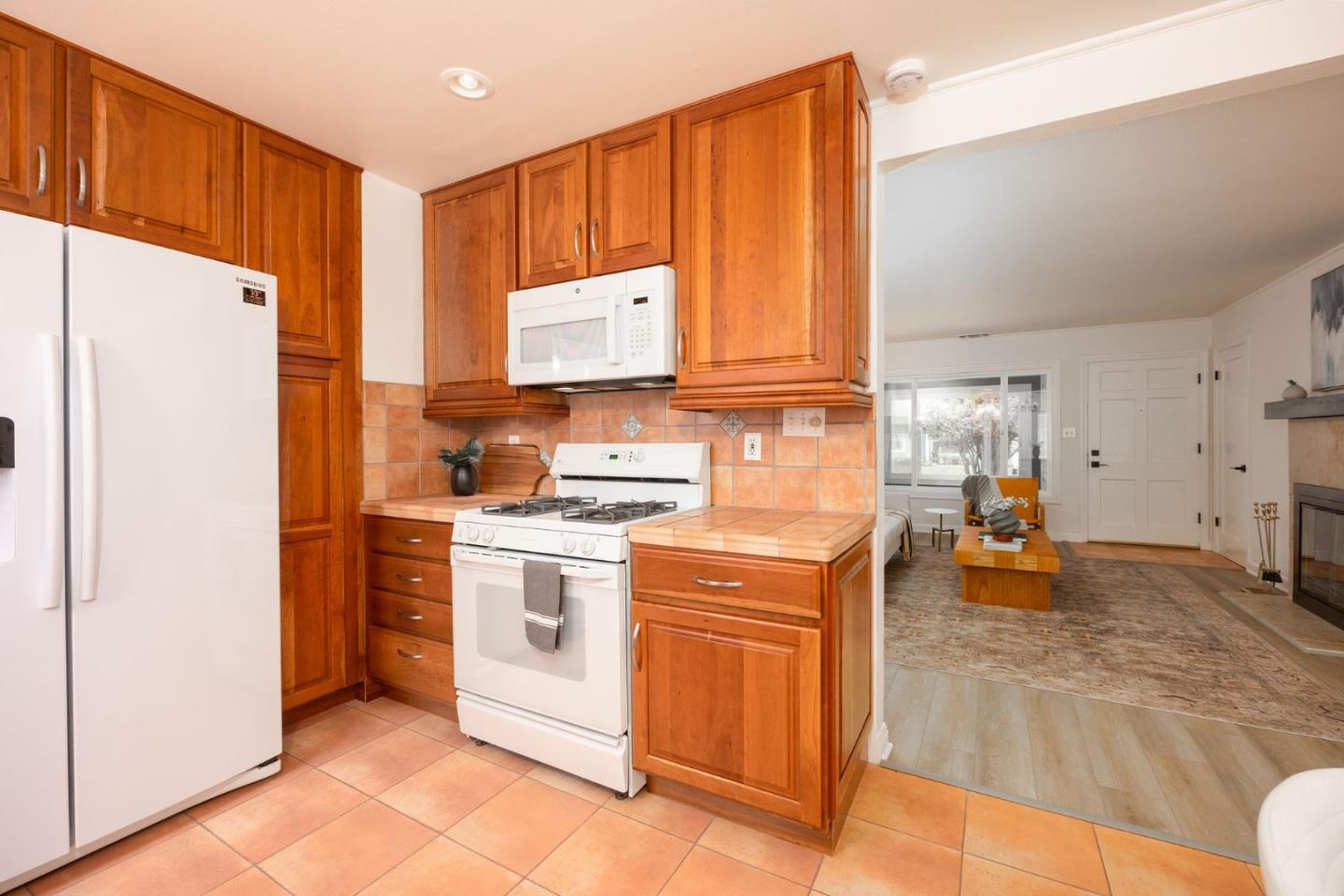 304 Nelson Avenue Pacifica, CA 94044 - Photo 18 of 39 a kitchen with a refrigerator and a stove