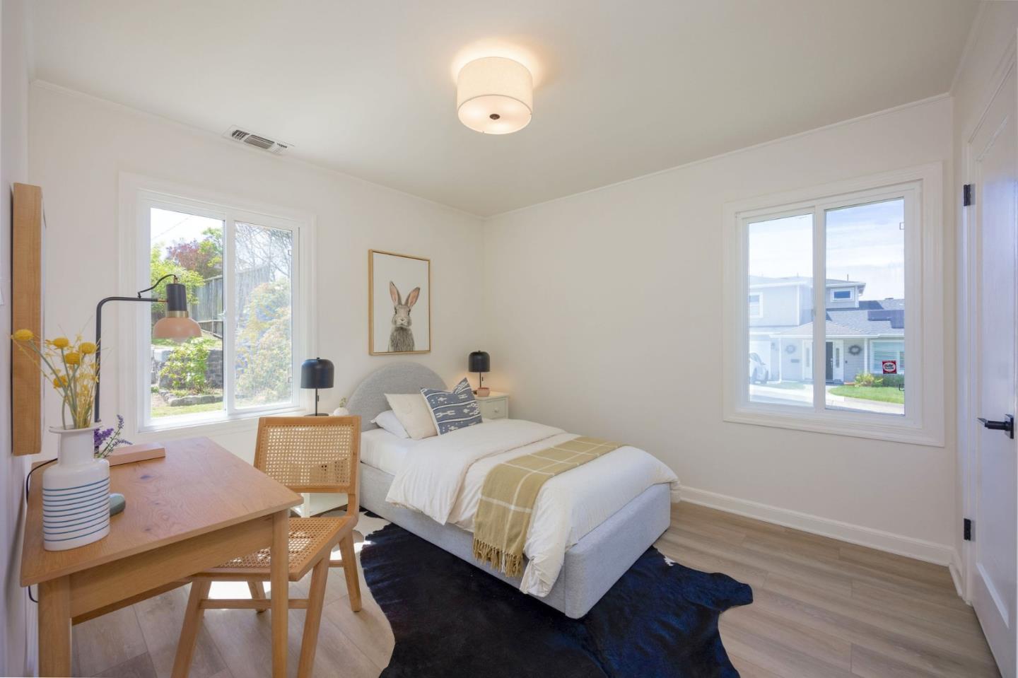 304 Nelson Avenue Pacifica, CA 94044 - Photo 20 of 39 a bedroom with a bed and wooden floor