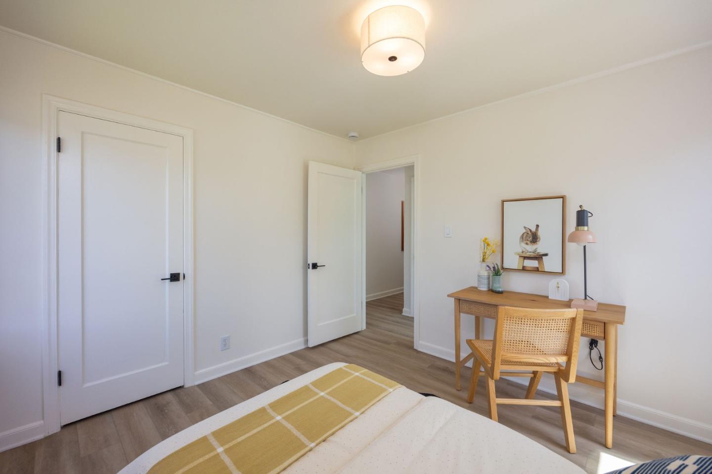 304 Nelson Avenue Pacifica, CA 94044 - Photo 22 of 39 a bedroom with a bed and a table in it