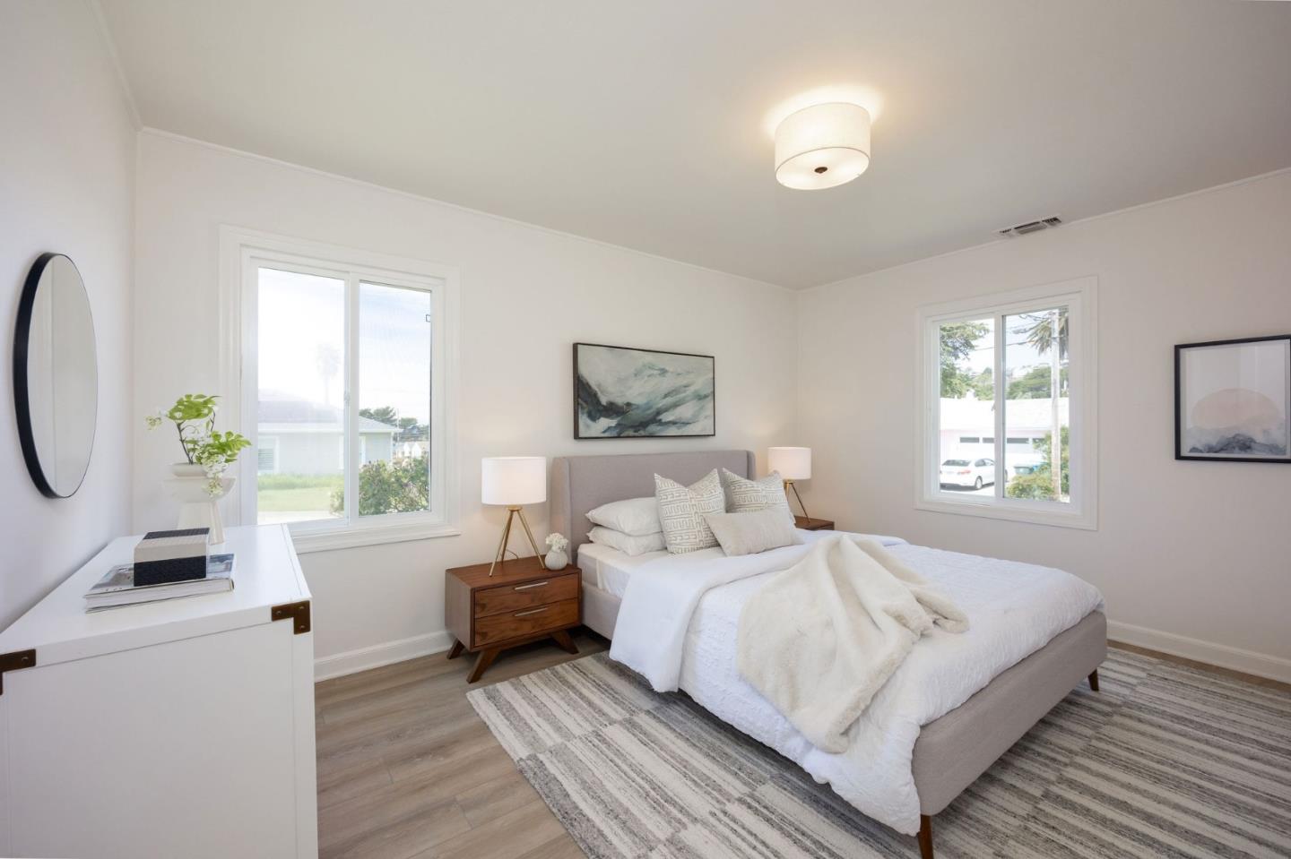 304 Nelson Avenue Pacifica, CA 94044 - Photo 23 of 39 a bedroom with a large bed and a window