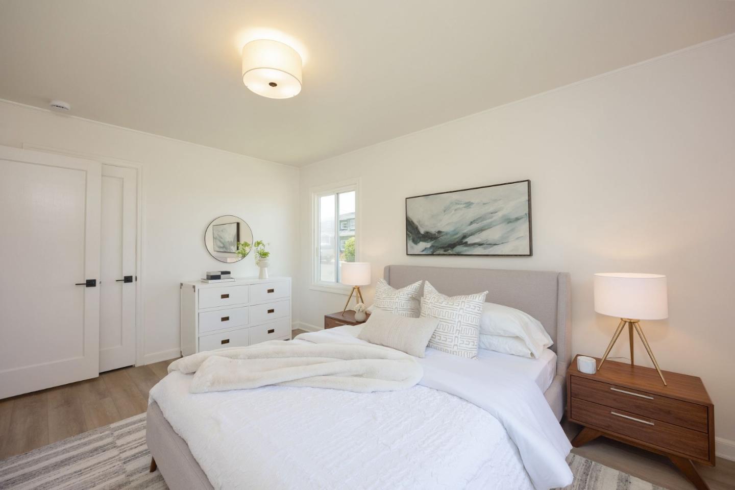 304 Nelson Avenue Pacifica, CA 94044 - Photo 25 of 39 a bedroom with a bed and a lamp on dresser