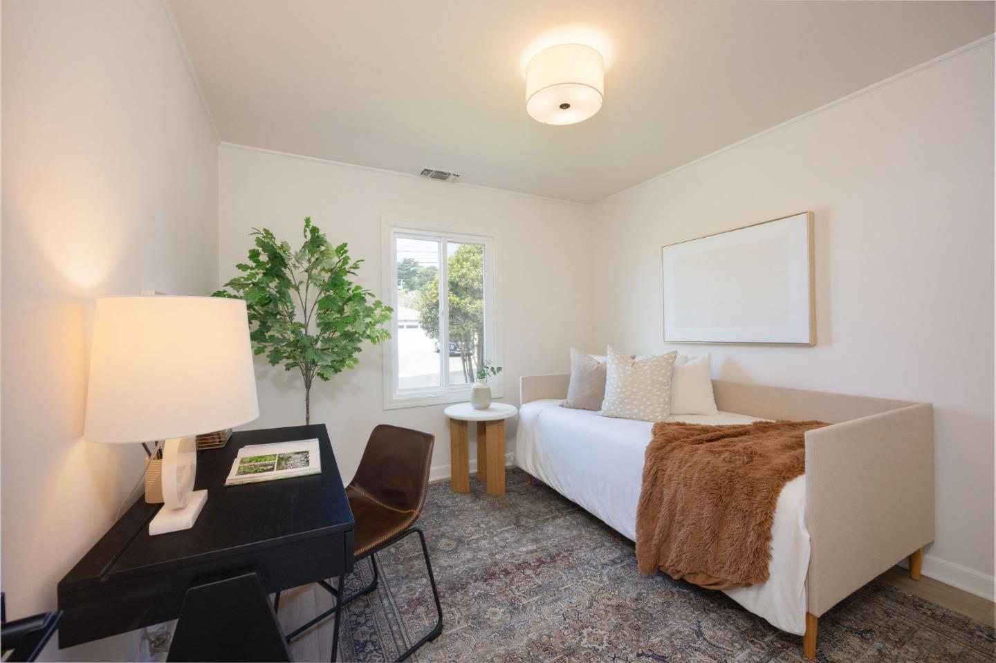 304 Nelson Avenue Pacifica, CA 94044 - Photo 26 of 39 a living room with furniture and a potted plant