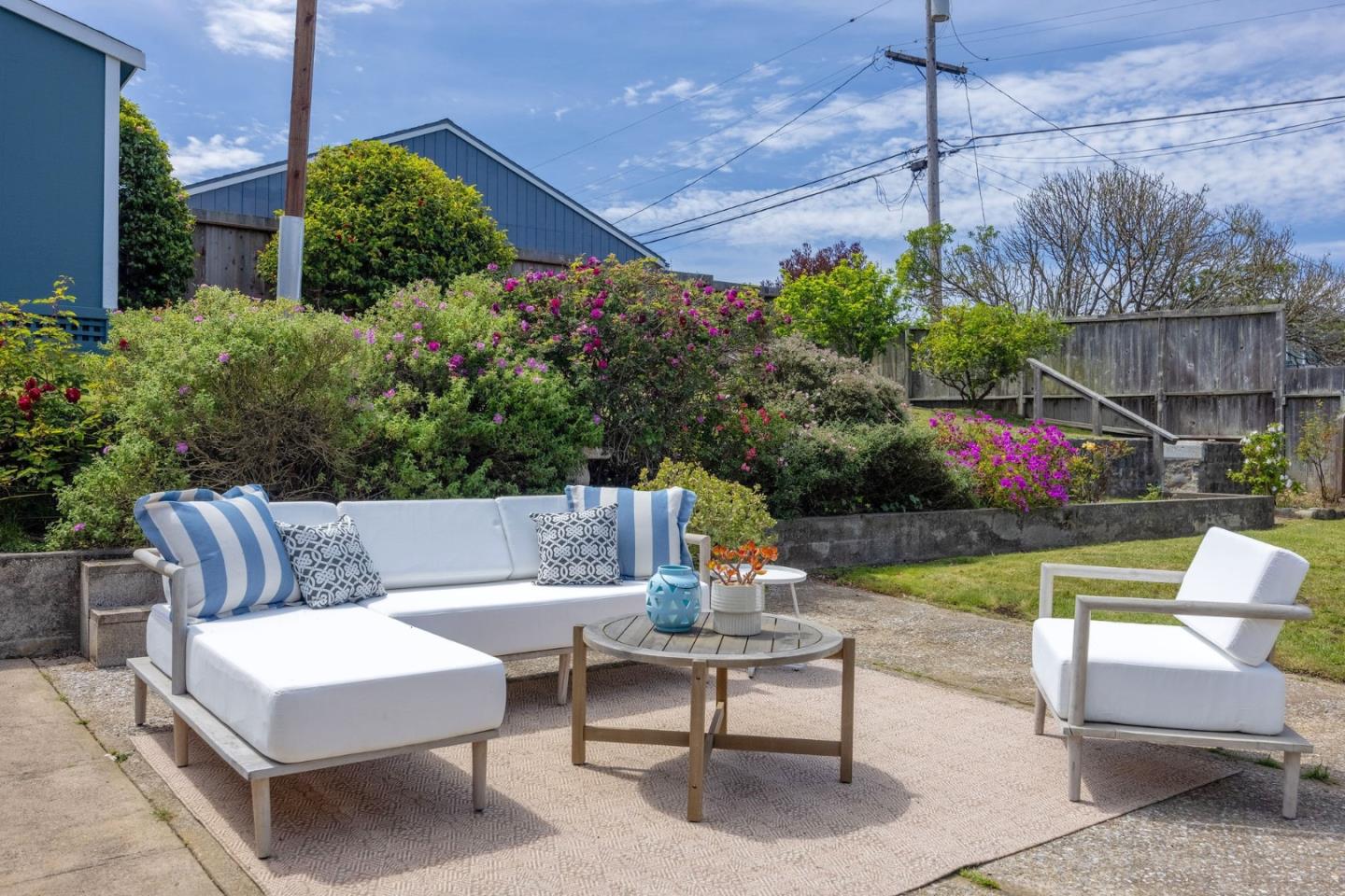 304 Nelson Avenue Pacifica, CA 94044 - Photo 32 of 39 a view of a patio with couches a table and chairs and potted plants