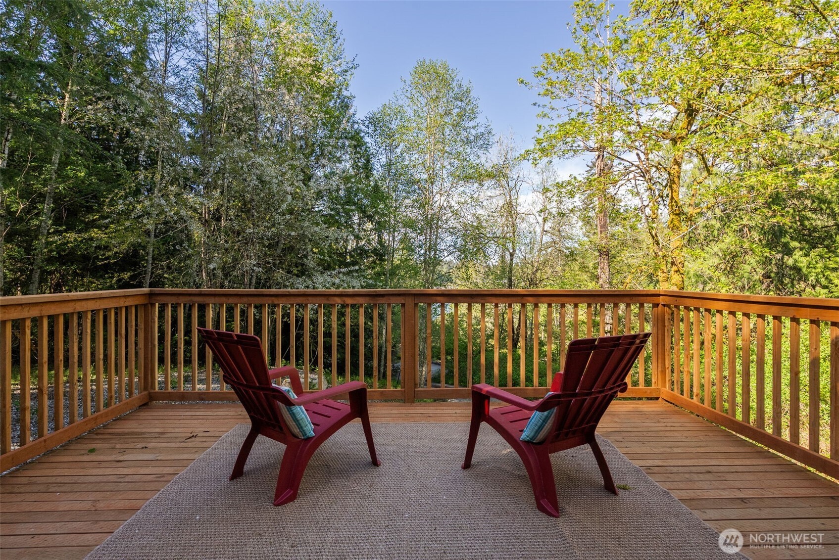 a view of a two chairs in the balcony