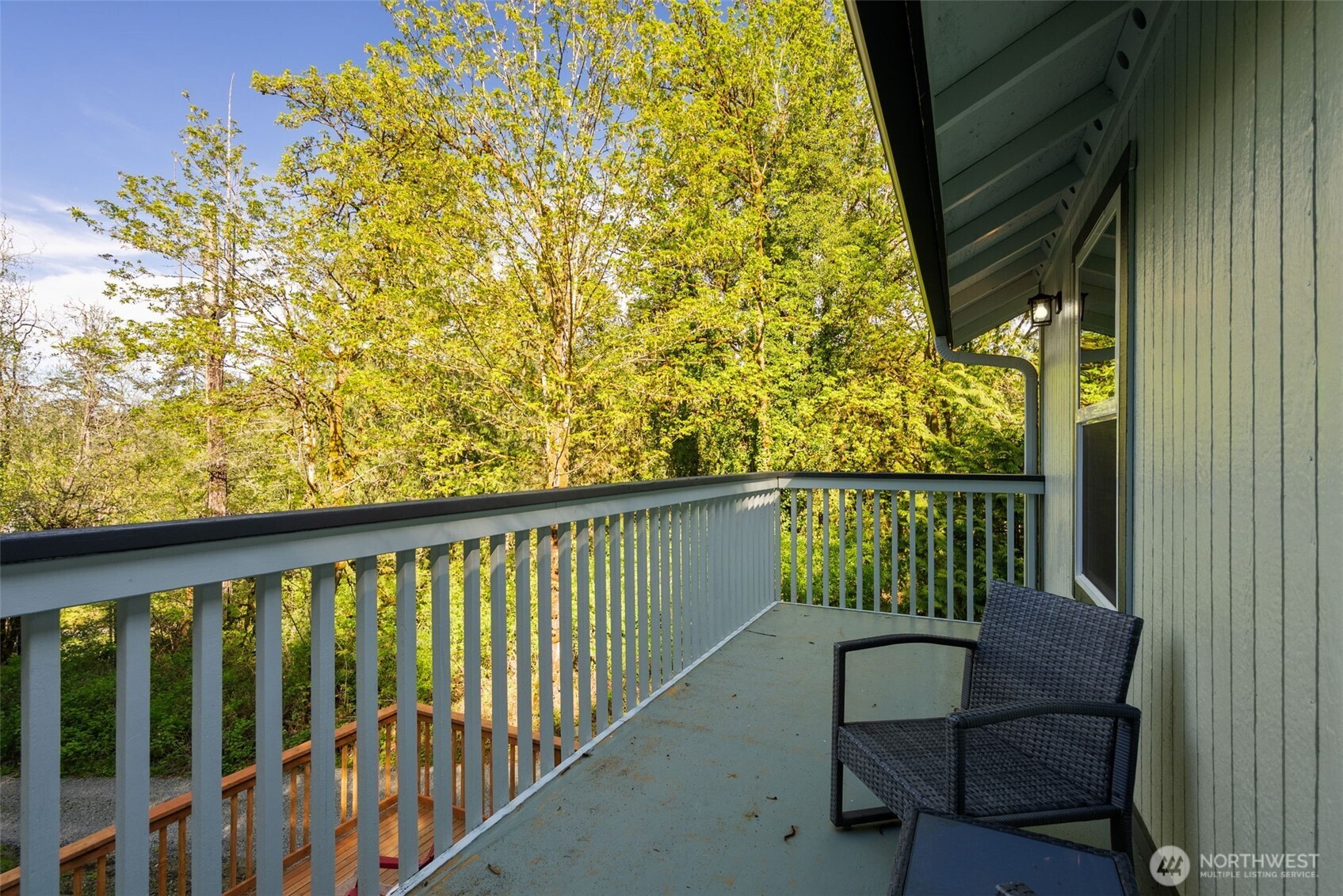 7605 Northeast Hidden Cove Road Bainbridge Island, WA 98110 - Photo 17 of 39 a view of balcony with wooden floor