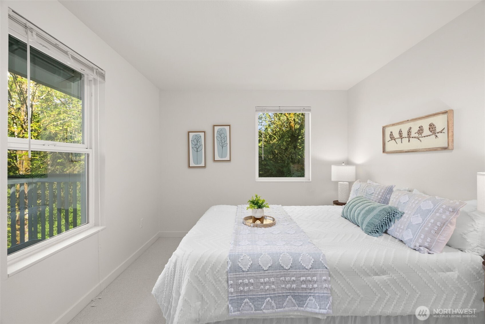 7605 Northeast Hidden Cove Road Bainbridge Island, WA 98110 - Photo 20 of 39 a bedroom with a bed and a window