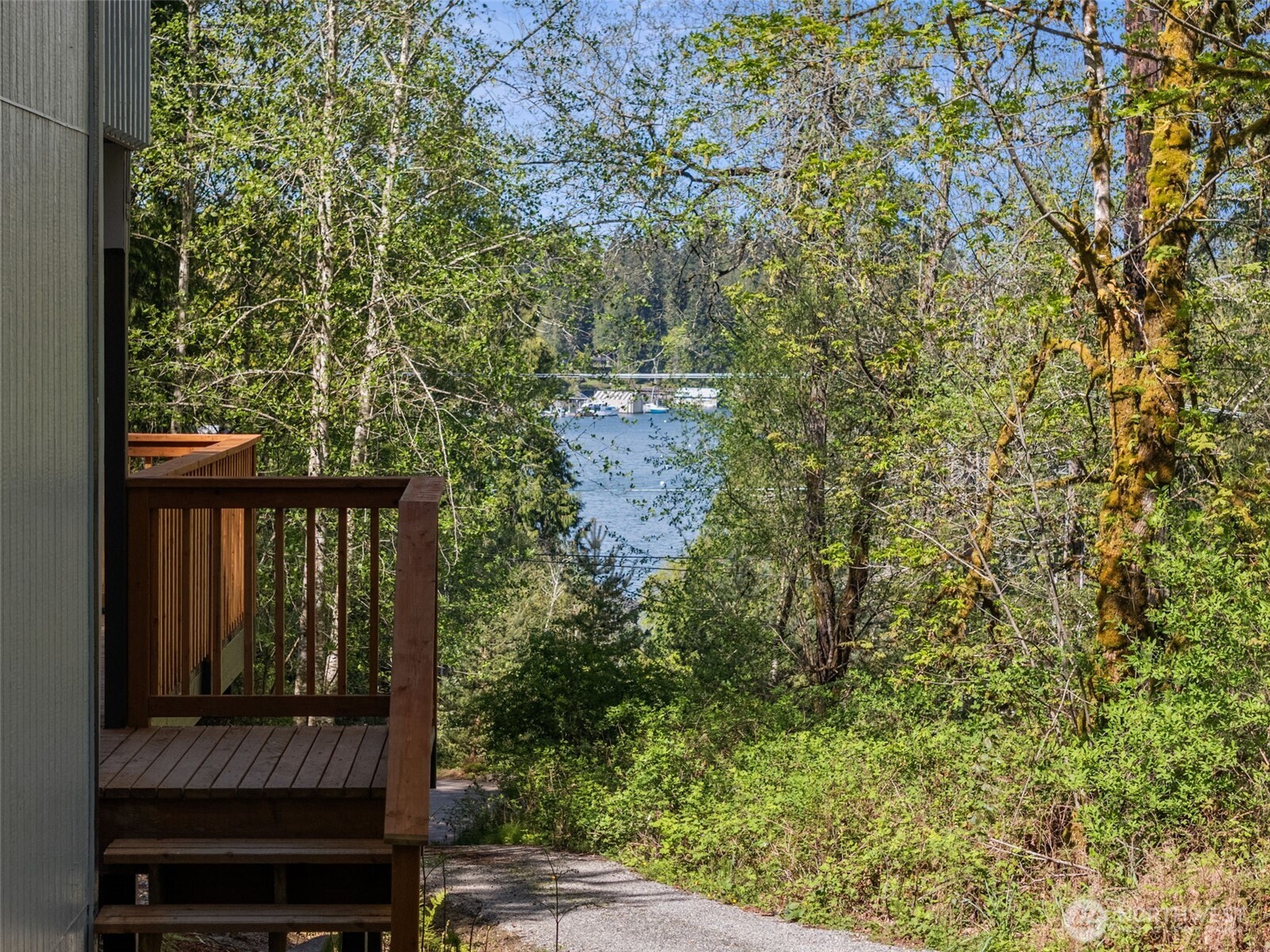 7605 Northeast Hidden Cove Road Bainbridge Island, WA 98110 - Photo 2 of 39 a view of a balcony with an outdoor space