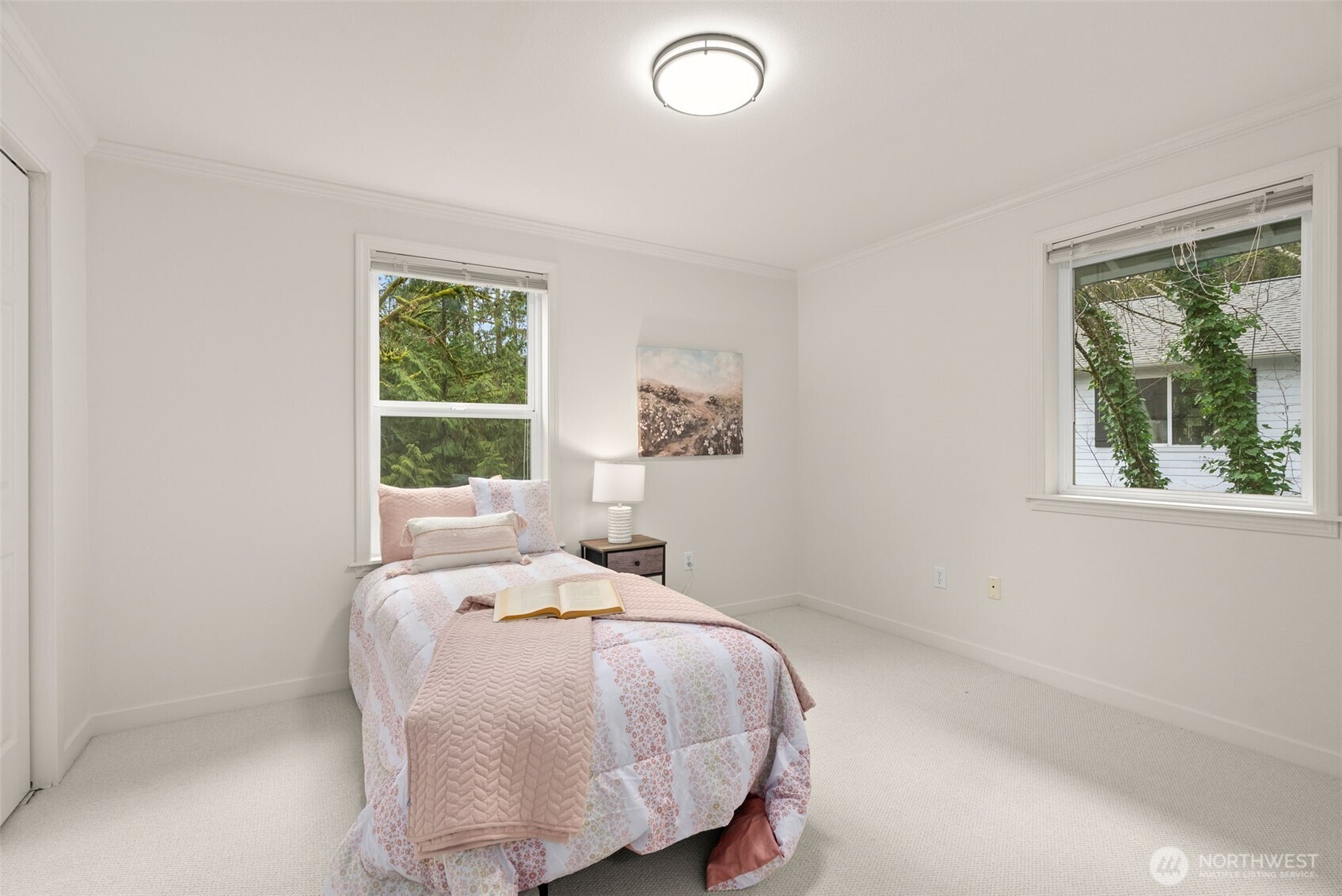 7605 Northeast Hidden Cove Road Bainbridge Island, WA 98110 - Photo 22 of 39 a bedroom with a bed and a window