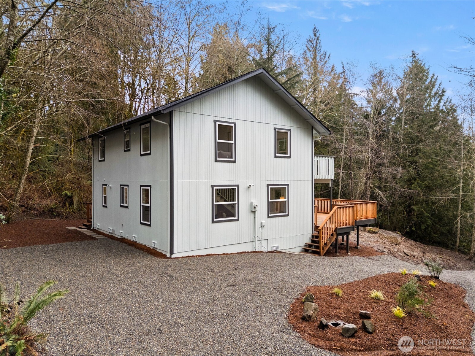 7605 Northeast Hidden Cove Road Bainbridge Island, WA 98110 - Photo 27 of 39 a view of a house with backyard