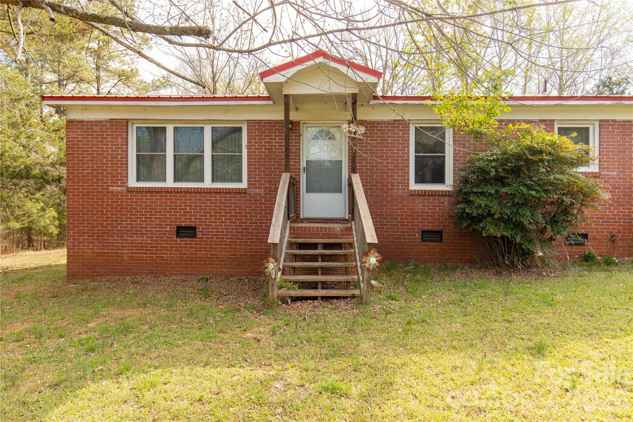 1724 State Rd S-29-39 Lancaster, SC 29720 - Photo 3 of 29 a front view of a house with a yard