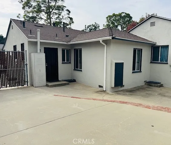 a view of a back yard with a patio