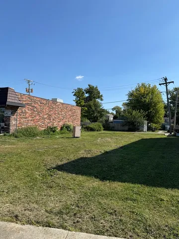 a view of a garden with houses