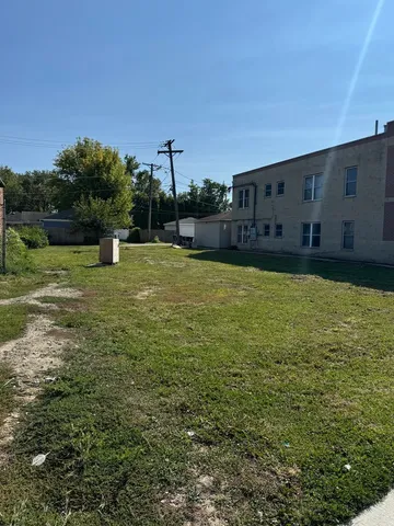 a swimming pool with yard and outdoor seating