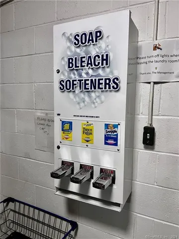 a table with a couch and a white stove next to a white cabinet