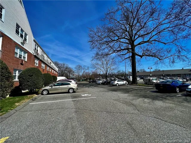 a view of street with parked cars