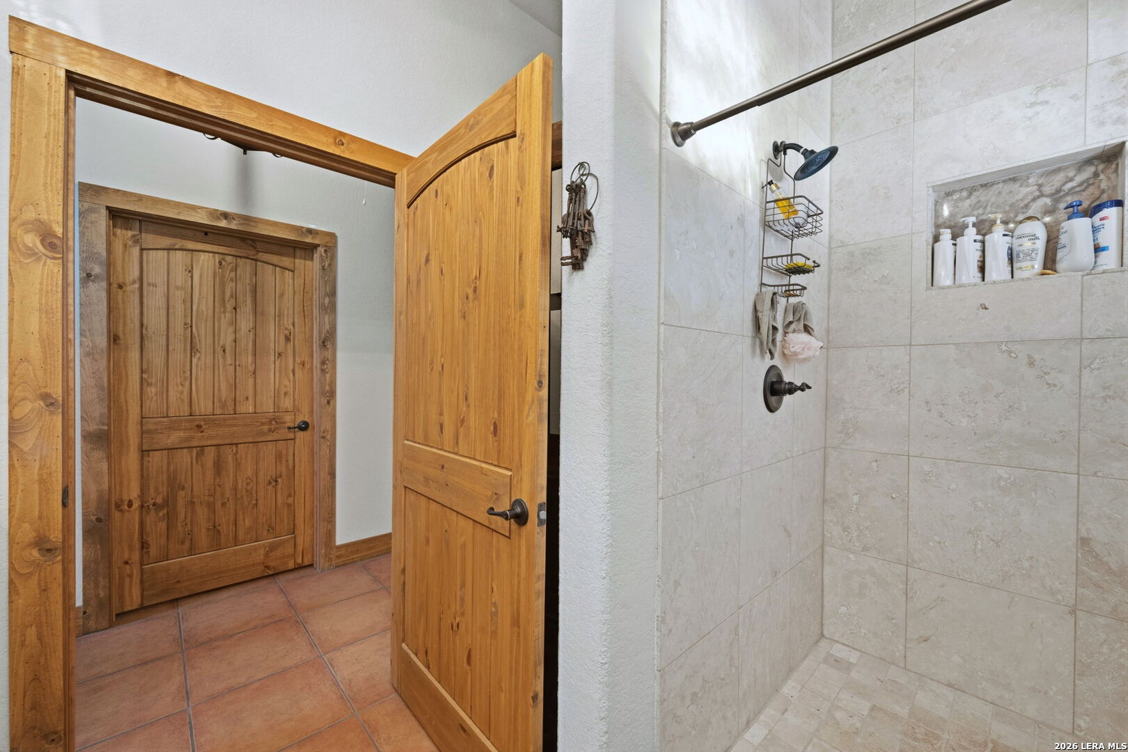 1150 Bruce Road Poteet, TX 78065 - Photo 24 of 33 a bathroom with a shower and a sink