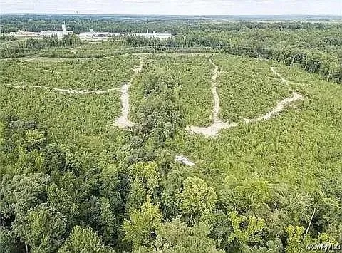 a view of a field with a lush green field