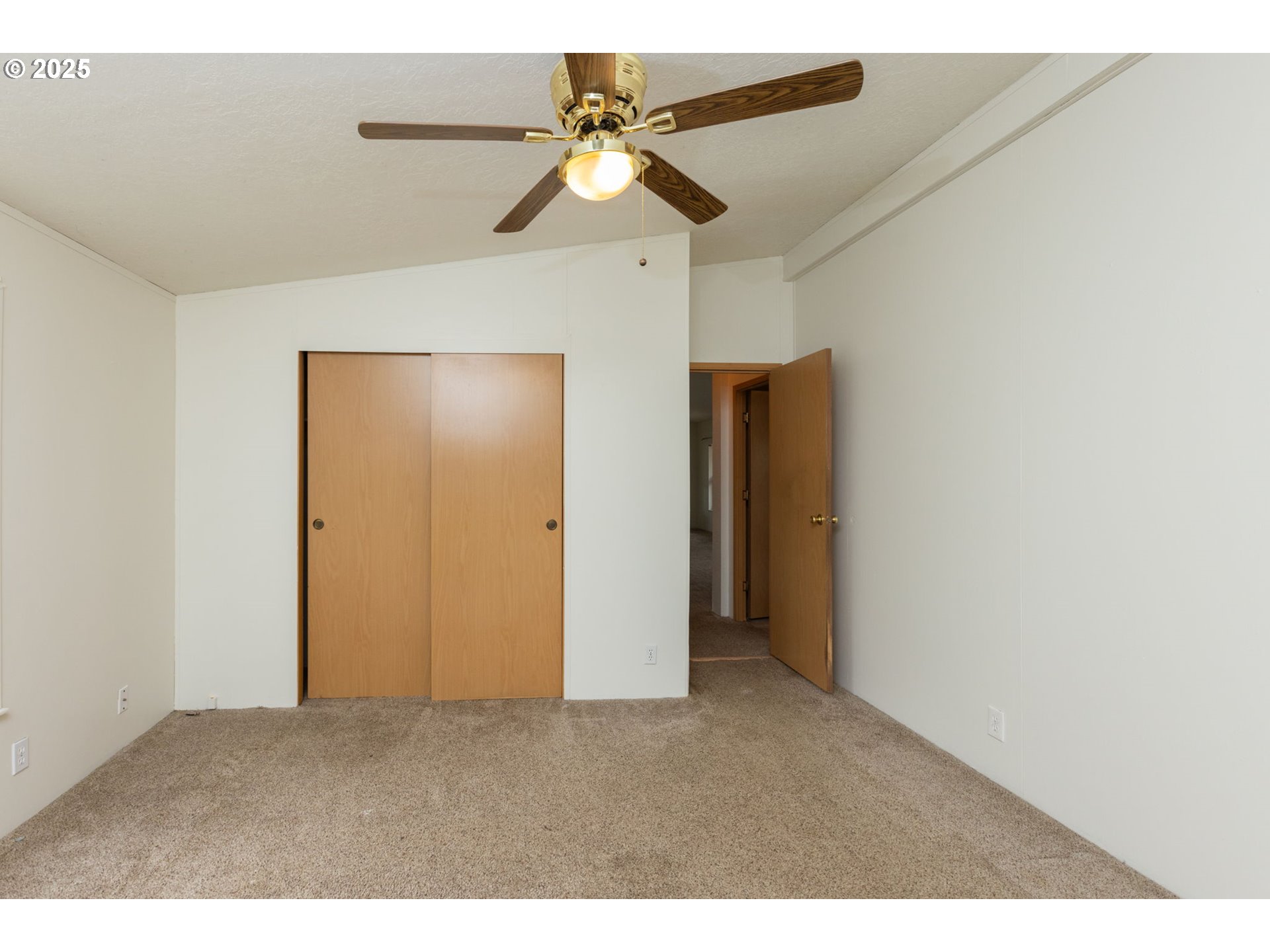 1655 South Elm Street Canby, OR 97013 - Photo 14 of 32 a view of an empty room with a ceiling fan