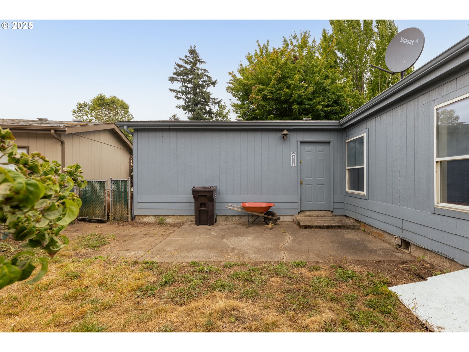 1655 South Elm Street Canby, OR 97013 - Photo 28 of 32 a backyard of a house with lots of green space