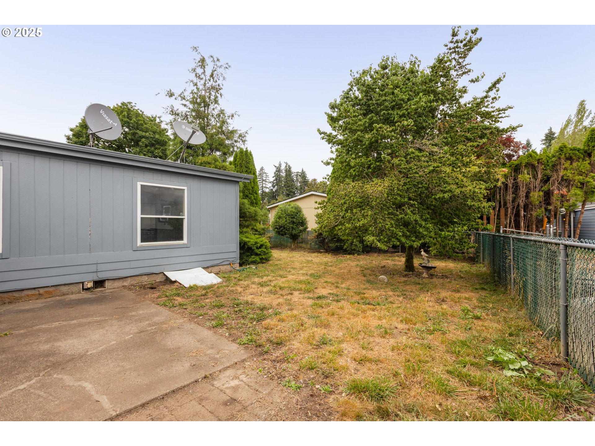 1655 South Elm Street Canby, OR 97013 - Photo 30 of 32 a backyard of a house with lots of green space