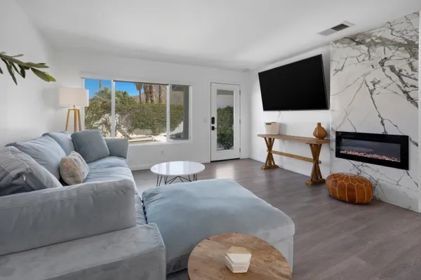a living room with furniture and a flat screen tv