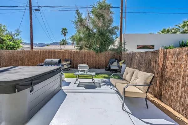 an outdoor sitting area with a couch