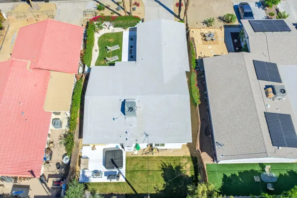 an aerial view of residential house with outdoor space and parking