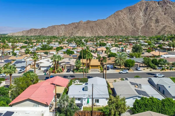 an aerial view of residential houses with outdoor space