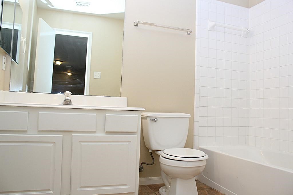 3231 Stoneydale Lane Spring, TX 77388 - Photo 13 of 16 a bathroom with a toilet sink and mirror