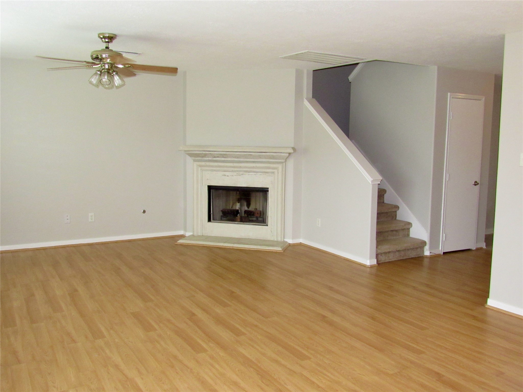 3231 Stoneydale Lane Spring, TX 77388 - Photo 3 of 16 a view of a livingroom with wooden floor and a fireplace